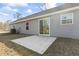 Back of home with a concrete patio and sliding glass door with an air conditioner at 4344 Jones Rd., Myrtle Beach, SC 29588