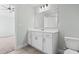 Bathroom with tile floors, vanity, and mirror adjacent to the bedroom at 4344 Jones Rd., Myrtle Beach, SC 29588