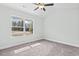 Bedroom featuring neutral carpet, a ceiling fan, natural light from a window, and neutral paint at 4344 Jones Rd., Myrtle Beach, SC 29588