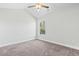 Bedroom featuring neutral carpet, a ceiling fan, natural light from a window, and neutral paint at 4344 Jones Rd., Myrtle Beach, SC 29588