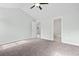 Spacious bedroom showcasing neutral walls, walk-in closet, carpet, and a ceiling fan at 4344 Jones Rd., Myrtle Beach, SC 29588