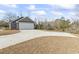 Long concrete driveway leading to an attached two-car garage, surrounded by a grassy yard at 4344 Jones Rd., Myrtle Beach, SC 29588