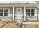 Charming home entrance with stone accents, white siding, and a walkway at 4344 Jones Rd., Myrtle Beach, SC 29588