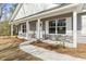 Inviting front porch with stone accents, white columns, and a manicured walkway at 4344 Jones Rd., Myrtle Beach, SC 29588