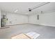 Well-lit garage with water heater and utility hookups for laundry appliances at 4344 Jones Rd., Myrtle Beach, SC 29588