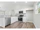 Stylish eat-in kitchen features white cabinetry, stainless appliances and granite countertop breakfast bar at 4344 Jones Rd., Myrtle Beach, SC 29588