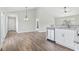 Open-concept living area shows kitchen and dining area with modern fixtures and finishes at 4344 Jones Rd., Myrtle Beach, SC 29588