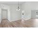 Open living space shows vaulted ceilings, wood-look floors, and neutral paint at 4344 Jones Rd., Myrtle Beach, SC 29588