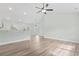 Open-concept living area with light walls, wood-look flooring, and modern lighting fixtures at 4344 Jones Rd., Myrtle Beach, SC 29588