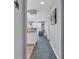 Hallway view showing the kitchen, living area, and access to outdoor balcony at 4413 Eastport Blvd. # F-1, Little River, SC 29566