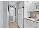 Kitchen includes major appliances with a view of laundry area at 4413 Eastport Blvd. # F-1, Little River, SC 29566