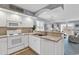 Open kitchen flowing into living space with major appliances and ample counter space at 4413 Eastport Blvd. # F-1, Little River, SC 29566