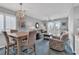Comfortable living room with dining area and balcony access, perfect for relaxing and entertaining guests at 4413 Eastport Blvd. # F-1, Little River, SC 29566