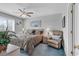 Comfortable bedroom with a ceiling fan, bedside tables and lamps, and a cozy recliner at 4413 Eastport Blvd. # F-1, Little River, SC 29566
