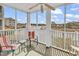 Relaxing screened-in porch offering a view of the surrounding community and a place to sit at 4413 Eastport Blvd. # F-1, Little River, SC 29566