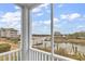 Waterfront property with a scenic view of the docks from a screened balcony at 4413 Eastport Blvd. # F-1, Little River, SC 29566