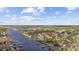 Aerial shot featuring waterfront condo homes along a river surrounded by a lush golf course at 4430 Eastport Blvd. # L5, Little River, SC 29566