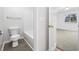Bathroom and bedroom featuring a toilet, bathtub and neutral carpet in the bedroom at 4430 Eastport Blvd. # L5, Little River, SC 29566