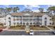 Well-maintained condo complex with multiple units, manicured landscaping, and convenient parking at 4430 Eastport Blvd. # L5, Little River, SC 29566
