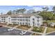 Aerial view of condo complex showcases manicured landscaping and ample parking at 4430 Eastport Blvd. # L5, Little River, SC 29566