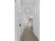 Bright hallway leads to an open-concept living area and a modern kitchen at 4430 Eastport Blvd. # L5, Little River, SC 29566