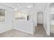Open-concept kitchen with white cabinets and bar seating, perfect for entertaining at 4430 Eastport Blvd. # L5, Little River, SC 29566