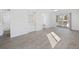 Living room featuring light gray flooring and sliding glass doors that let in plenty of natural light at 4430 Eastport Blvd. # L5, Little River, SC 29566