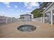 Community pool area, with a jacuzzi, surrounded by a white fence for added security at 4430 Eastport Blvd. # L5, Little River, SC 29566