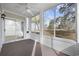 Relaxing screened porch with a ceiling fan and clear views of the outdoors at 4430 Eastport Blvd. # L5, Little River, SC 29566