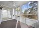 Relaxing screened porch with ceiling fan and views of the lush, green backyard at 4430 Eastport Blvd. # L5, Little River, SC 29566