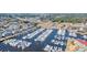 Aerial view of a full marina of boats and yachts with condos, businesses, and roadways in the background at 4440 Nassau Ct. # 502, Little River, SC 29566