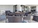 Balcony dining with an outdoor grill and marina views in the distance at 4440 Nassau Ct. # 502, Little River, SC 29566