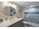 Elegant bathroom features a walk-in shower with decorative tile and a marble vanity at 4440 Nassau Ct. # 502, Little River, SC 29566