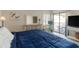 Bright bedroom includes a dresser, balcony access, and a dedicated workspace at 4440 Nassau Ct. # 502, Little River, SC 29566