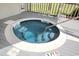 Close-up of a built-in round hot tub on a deck, showcasing its features and relaxing atmosphere at 4440 Nassau Ct. # 502, Little River, SC 29566