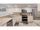 Modern kitchen featuring stainless steel appliances, granite countertops, and ample cabinet space at 4440 Nassau Ct. # 502, Little River, SC 29566