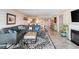 Open-concept living space featuring modern decor, tile flooring, and abundant natural light at 4440 Nassau Ct. # 502, Little River, SC 29566