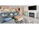 Bright living room features an open layout, modern decor, and a cozy fireplace at 4440 Nassau Ct. # 502, Little River, SC 29566