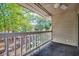 The balcony offers green views with a white railing and ceiling fan at 4466 Little River Inn Ln. # 906, Little River, SC 29566