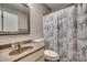 A bathroom featuring a vanity with hard surface countertop and neutral color shower curtain at 4466 Little River Inn Ln. # 906, Little River, SC 29566