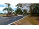 Entrance to community featuring mature landscaping and greenery at 4466 Little River Inn Ln. # 906, Little River, SC 29566