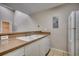 Kitchen featuring a double sink and white cabinets at 4466 Little River Inn Ln. # 906, Little River, SC 29566