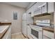 Bright kitchen with white appliances at 4466 Little River Inn Ln. # 906, Little River, SC 29566