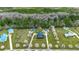 Aerial view of a beautiful estate with manicured lawns and mature trees lining the driveway at 451 Holly View Ln., Loris, SC 29569