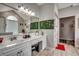 Bright bathroom with vanity, large mirror, decorative wall decor, and walk in shower at 451 Holly View Ln., Loris, SC 29569