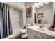 Clean bathroom featuring a shower/tub combo, stylish mirror and vanity, and fun decor at 451 Holly View Ln., Loris, SC 29569