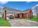 Spacious brick home with attached carport and long driveway at 451 Holly View Ln., Loris, SC 29569