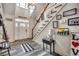 Inviting foyer with a white door, staircase, decor, and light hardwood flooring creating a warm, welcoming entrance at 451 Holly View Ln., Loris, SC 29569