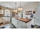 Spacious kitchen with a large island, modern appliances, and custom lighting, perfect for cooking and entertaining at 451 Holly View Ln., Loris, SC 29569