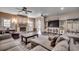 Cozy living room with a stone fireplace, ceiling fans, and a comfortable couch creating a relaxing atmosphere at 451 Holly View Ln., Loris, SC 29569